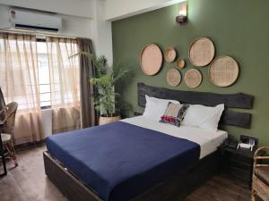 Postel nebo postele na pokoji v ubytování Peepal Tree Inn