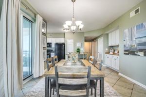 a dining room and kitchen with a table and chairs at Gulfport Oceanfront Vacation Rental Walk to Beach in Gulfport