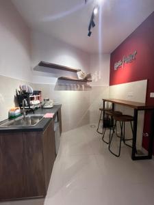 a kitchen with a sink and a counter top at THE SHORE KOTA KINABALU 5Pax Family Room in Kota Kinabalu