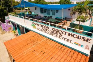 a boat with a sign that reads gamedan guest house at Studio 4 Casiguaya with Garden access in Vieques