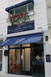 a building with a blue awning with flowers on it at The Capri Hotel Osmanbey in Istanbul