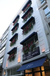 a hotel with flowerpots on the side of a building at The Capri Hotel Osmanbey in Istanbul
