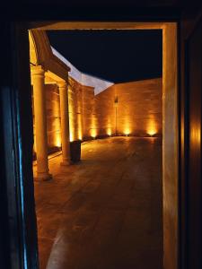 an empty hallway with lights in a building at night at Four Mansions Hotel in Kayseri