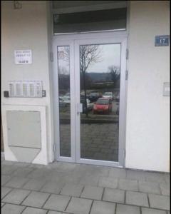 an entrance to a building with a glass door at Apartment 4th. Floor in Banja Luka