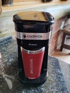 a black and red coffee maker on a counter at Pousada Emerich in Cambara do Sul