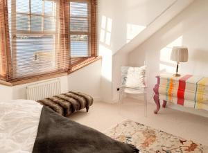 Un pat sau paturi într-o cameră la Sandbankhouse Campbeltown