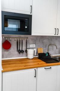 Kuhinja ili čajna kuhinja u objektu Aspectus apartmani Divcibare