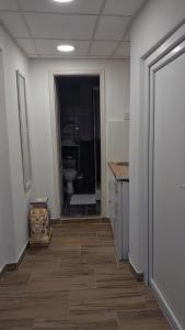 a hallway with a bathroom with a toilet in a room at Nada's room with terrace in Kotor +11 photos