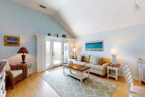 a living room with a couch and a table at 13104 Pelican Watch in Seabrook Island