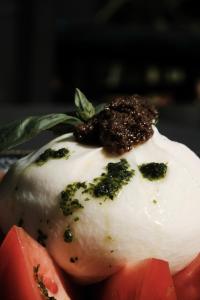 a piece of food with broccoli on top of it at Prinsotel La Dorada & Spa in Playa de Muro