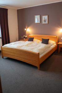 Postel nebo postele na pokoji v ubytování Hotel Kickert