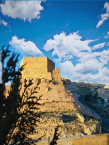 a castle on top of a hill with a blue sky at mountain view house in Kerak