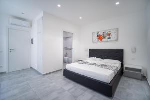 Postel nebo postele na pokoji v ubytování Vincent GUESTHOUSE