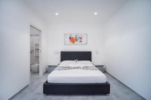 Postel nebo postele na pokoji v ubytování Vincent GUESTHOUSE