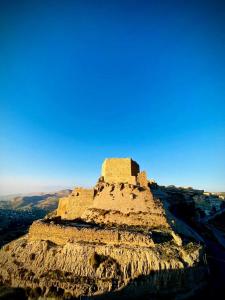 a castle on the top of a mountain at mountain view house in Kerak