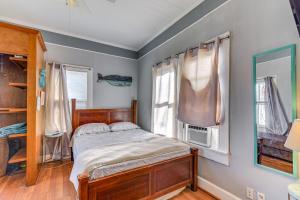 a bedroom with a bed and a window at Coastal Galveston Studio about 1 Mi to Beach! in Galveston