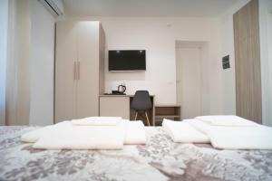 Postel nebo postele na pokoji v ubytování Vincent GUESTHOUSE