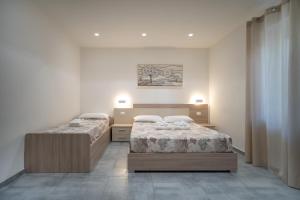 Postel nebo postele na pokoji v ubytování Vincent GUESTHOUSE