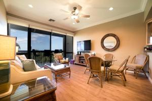 a living room with a couch and a table at Maui Vista 3406 - Ocean View Penthouse Sleeps 7 in Kihei