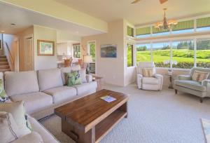 a living room with a couch and a coffee table at 2511 Ridge in Kahana