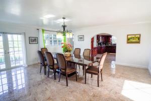 a dining room with a table and chairs at NEW Chalk Sound Home BBQ Pool Beach Steps Away in Providenciales