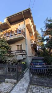 a car parked in front of a building at Cozy Ivana's Apartment in Skopje