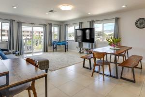 a living room with a couch and a table at Ewa Beach Apartment about 1 Mi to Puʻuloa Beach Park! in Kapolei