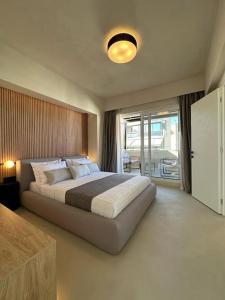 Ένα ή περισσότερα κρεβάτια σε δωμάτιο στο BlueMotion - SkytouchSuite