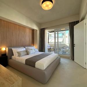 Ένα ή περισσότερα κρεβάτια σε δωμάτιο στο BlueMotion - SkytouchSuite +41 φωτογραφίες