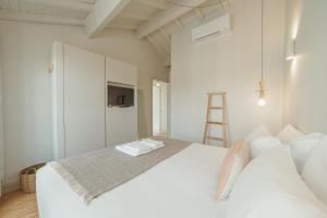 מיטה או מיטות בחדר ב-Deluxe Duplex by Hosty