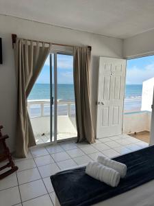 Postel nebo postele na pokoji v ubytování Hotel Grand Bahía Los Cocos