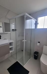 Ванная комната в Quartos Confortáveis - 5 min Aeroporto Internacional
