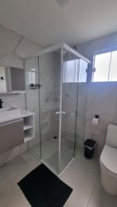 Ванная комната в Quartos Confortáveis - 5 min Aeroporto Internacional