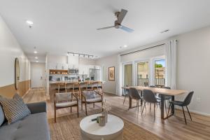 a living room and kitchen with a table and chairs at Winton Flats by MilaPad in Atlanta