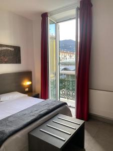 Ένα ή περισσότερα κρεβάτια σε δωμάτιο στο 54 ROSSELLI ROOMS