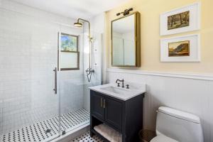 a bathroom with a sink and a mirror at Catskills Delaware River Modern Colonial Getaway in Narrowsburg