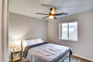 a bedroom with a bed and a ceiling fan at Fire Pit and Covered Patio Bullhead City Escape! in Bullhead City