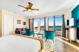 a bedroom with a bed and a living room at Sanctuary by the Sea 3114 in Santa Rosa Beach