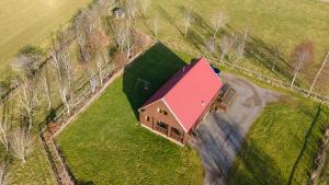 an overhead view of a large house with a red roof at The New Farmhouse in Biggar
