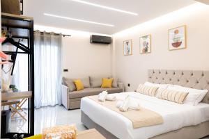 Postel nebo postele na pokoji v ubytování Elite Suite Loutraki
