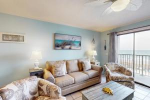 a living room with a couch and a table at Myrtle Beach Resort A306 in Myrtle Beach