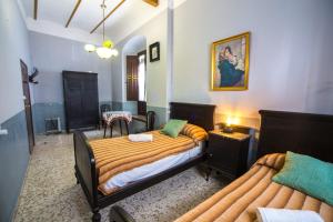 Posteľ alebo postele v izbe v ubytovaní La Casa del Cura 1935