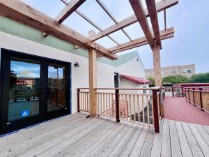 a porch with a glass door on a building at Monterey Hostel in Monterey