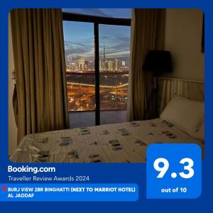 a hotel room with a bed and a window at Burj View 2BR Binghatti - Next to Marriot Hotel - Al Jaddaf in Dubai