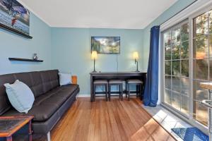 a living room with a couch and a table at West Fairway in Coeur d'Alene +2 photos