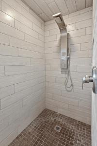 a bathroom with a shower with a shower head at West Fairway in Coeur d'Alene