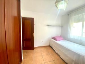 Łóżko lub łóżka w pokoju w obiekcie Casa Cony