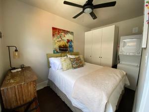 a bedroom with a bed and a ceiling fan at The Chic Guest Retreat in Old Town near CSU! in Fort Collins