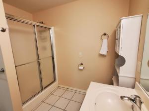 a bathroom with a shower and a sink at Master Bed & Bath Just For You in Bentonville