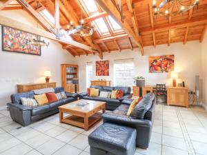 a living room with couches and a table at The Lodge in Grantham